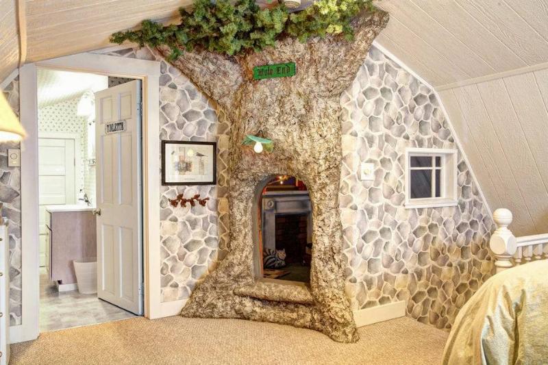 secret playroom in tree mural 