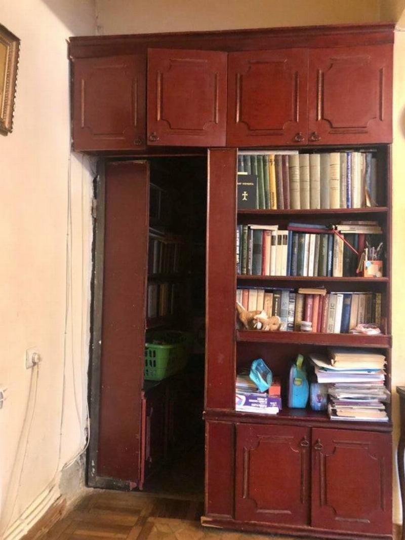 secret room next to bookshelf