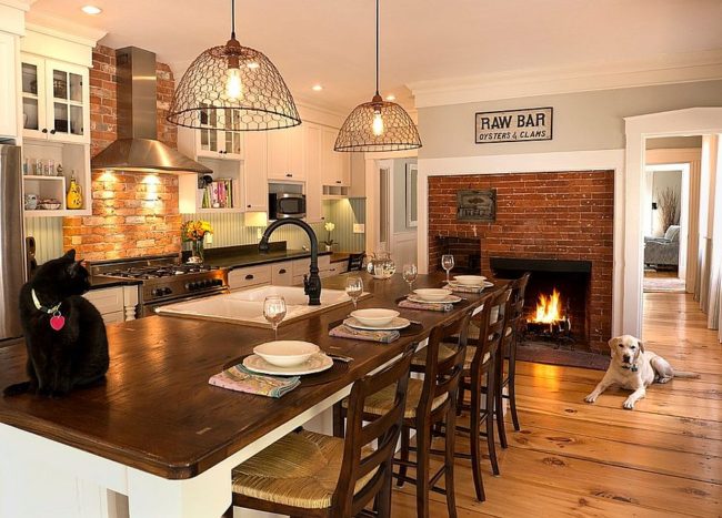 Hot Trends Give Your Kitchen A Sizzling Makeover With A Fireplace   Traditional Brick Fireplace Serves Both The Kitchen And The Breakfast Zone 650x467 